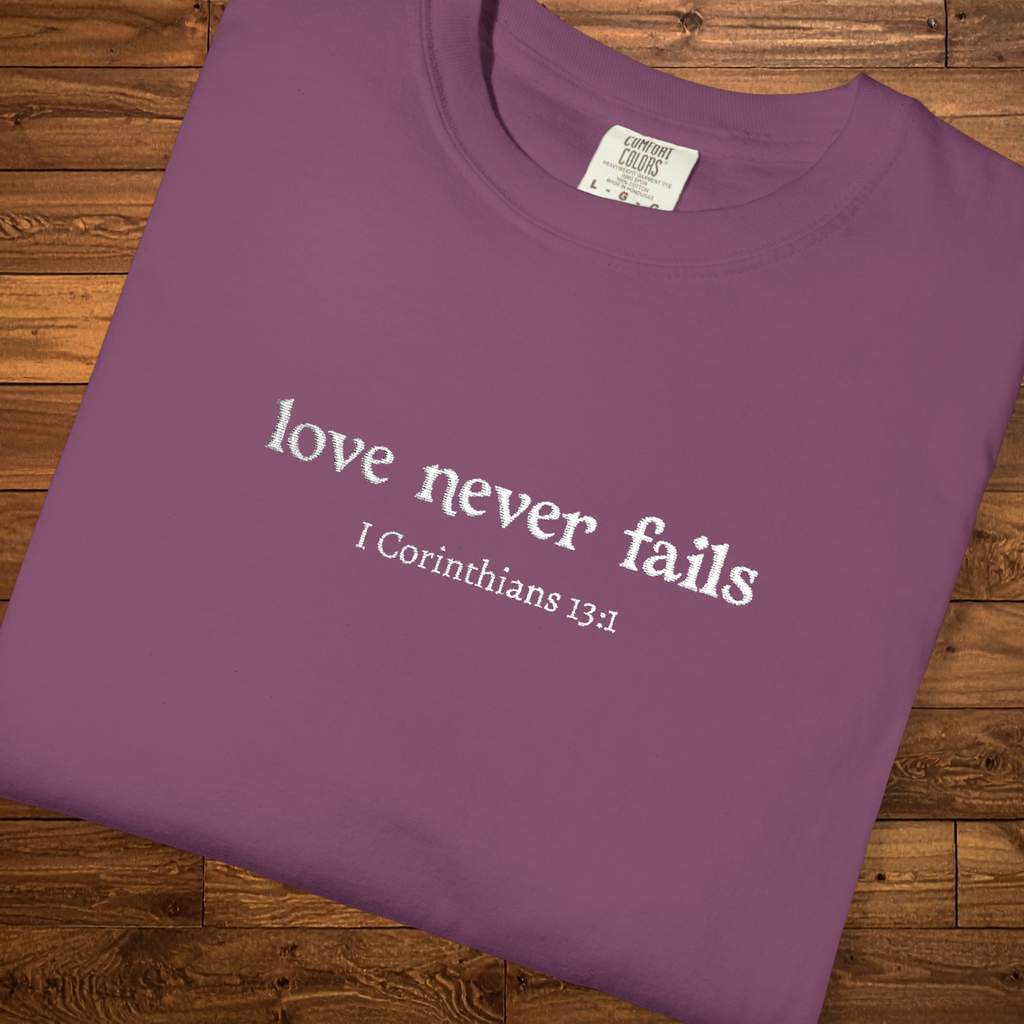 Love Never Fails Tee | White Embroidery | 1 Corinthians Scripture T-Shirt