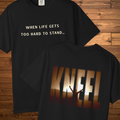 Front and back view of the Kneel faith graphic t-shirt featuring “When Life Gets Too Hard to Stand...” on the front and a large sunset-inspired “KNEEL” design on the back, symbolizing the power of prayer during difficult seasons.