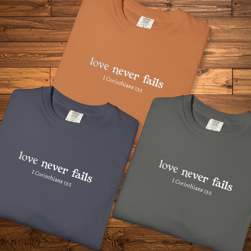 Love Never Fails Tee | White Embroidery | 1 Corinthians Scripture T-Shirt