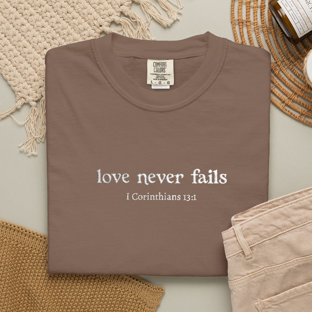 Love Never Fails Tee | White Embroidery | 1 Corinthians Scripture T-Shirt