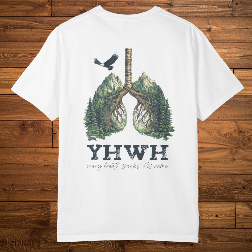 Back of a white faith-based t-shirt featuring lungs formed from mountains, trees, and roots above the phrase “YHWH – every breath speaks His name.”